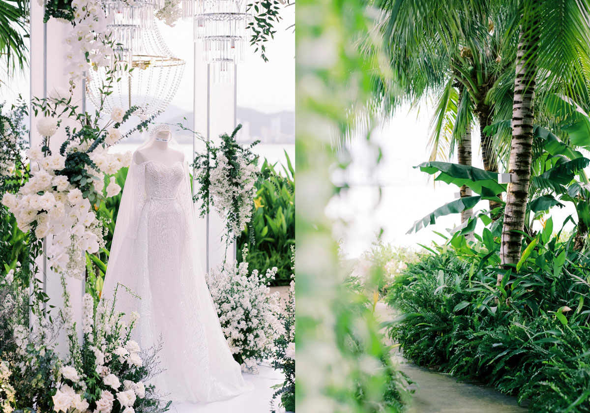 Wedding dress on a stand among white flowers beside a palm-lined path Wedding dress on a stand among white flowers beside a palm-lined path